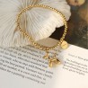 Bracelet with a dog motif, gold color
